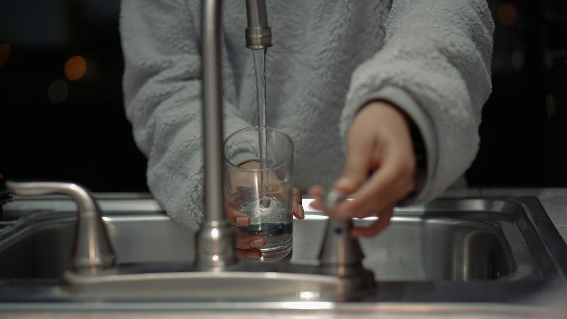 getting water from faucet