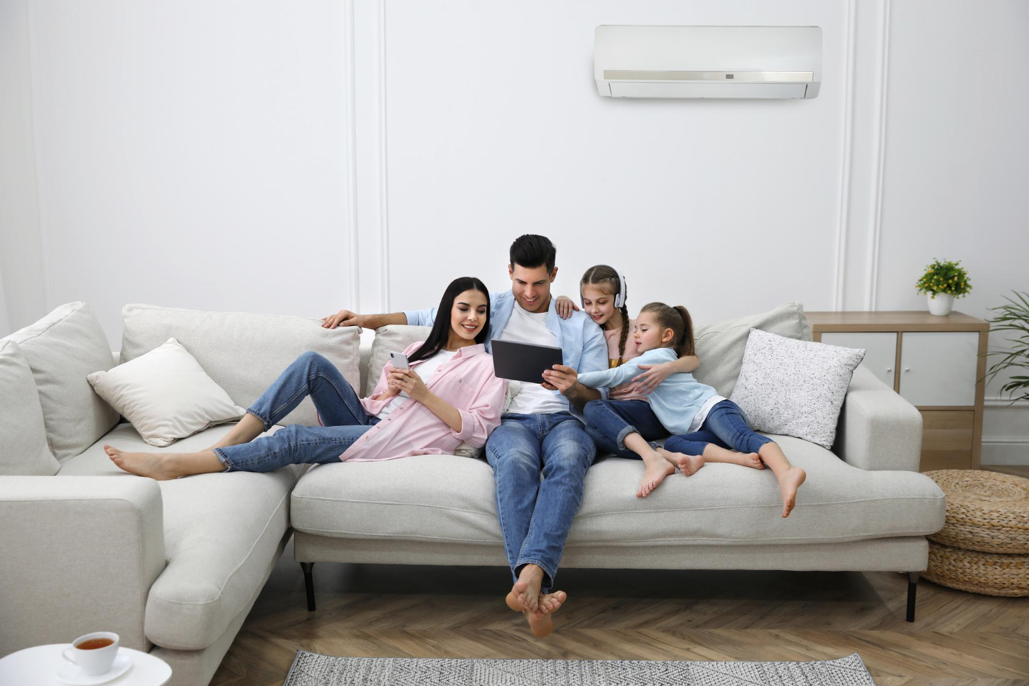 family at home with ac system